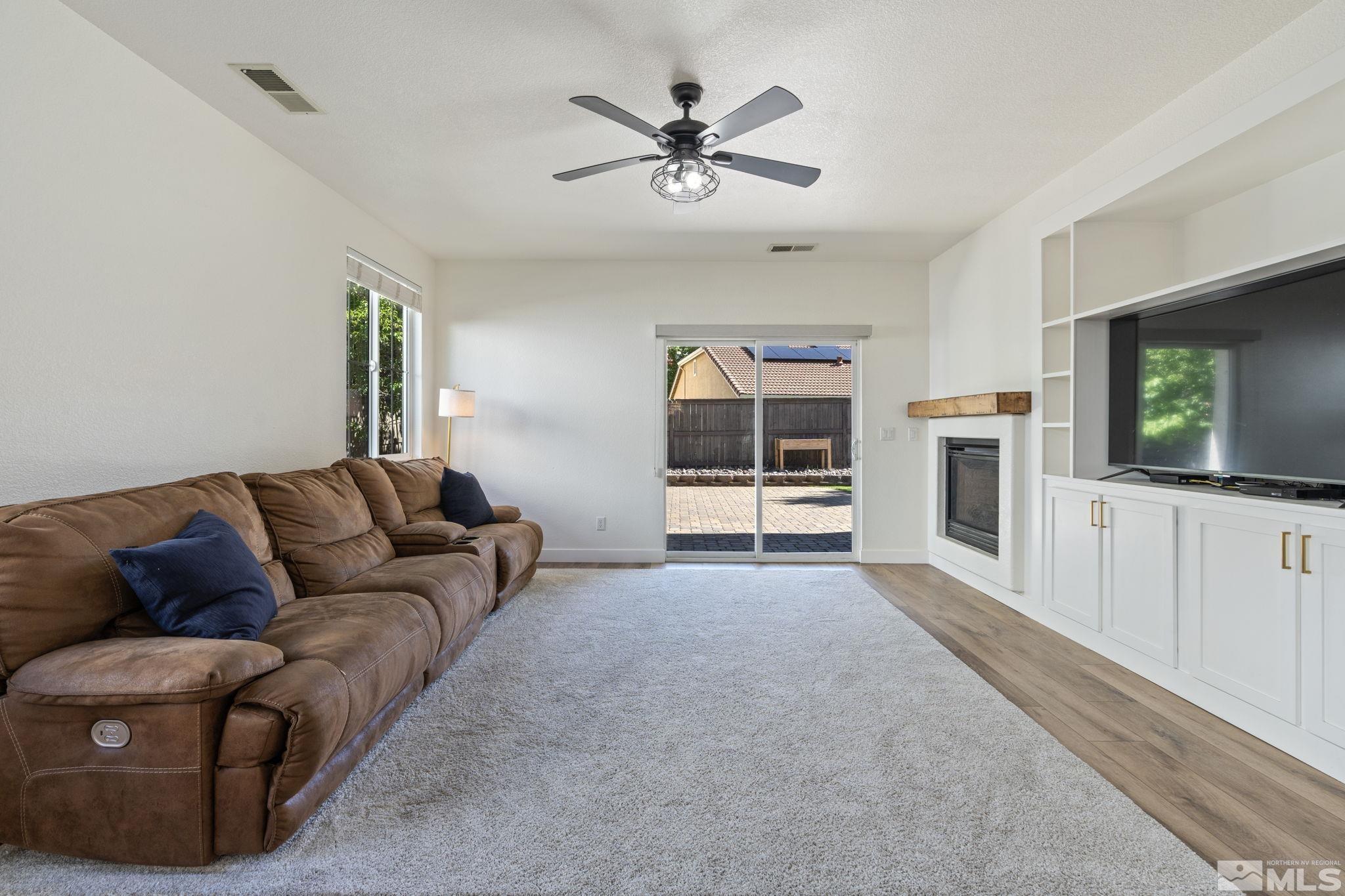 541 Needles Court Reno, NV 89521 - Photo 13 of 35 a living room with furniture and a flat screen tv