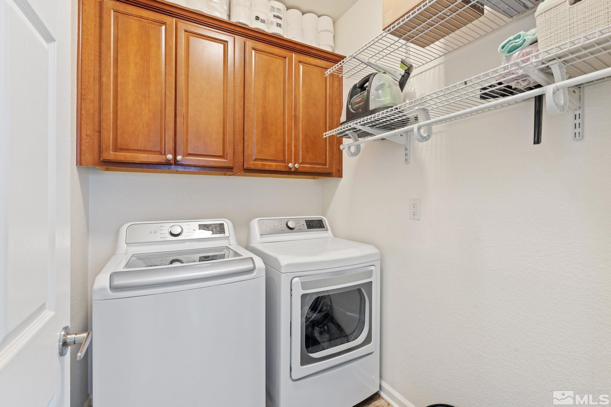 541 Needles Court Reno, NV 89521 - Photo 24 of 35 a utility room with dryer and washer