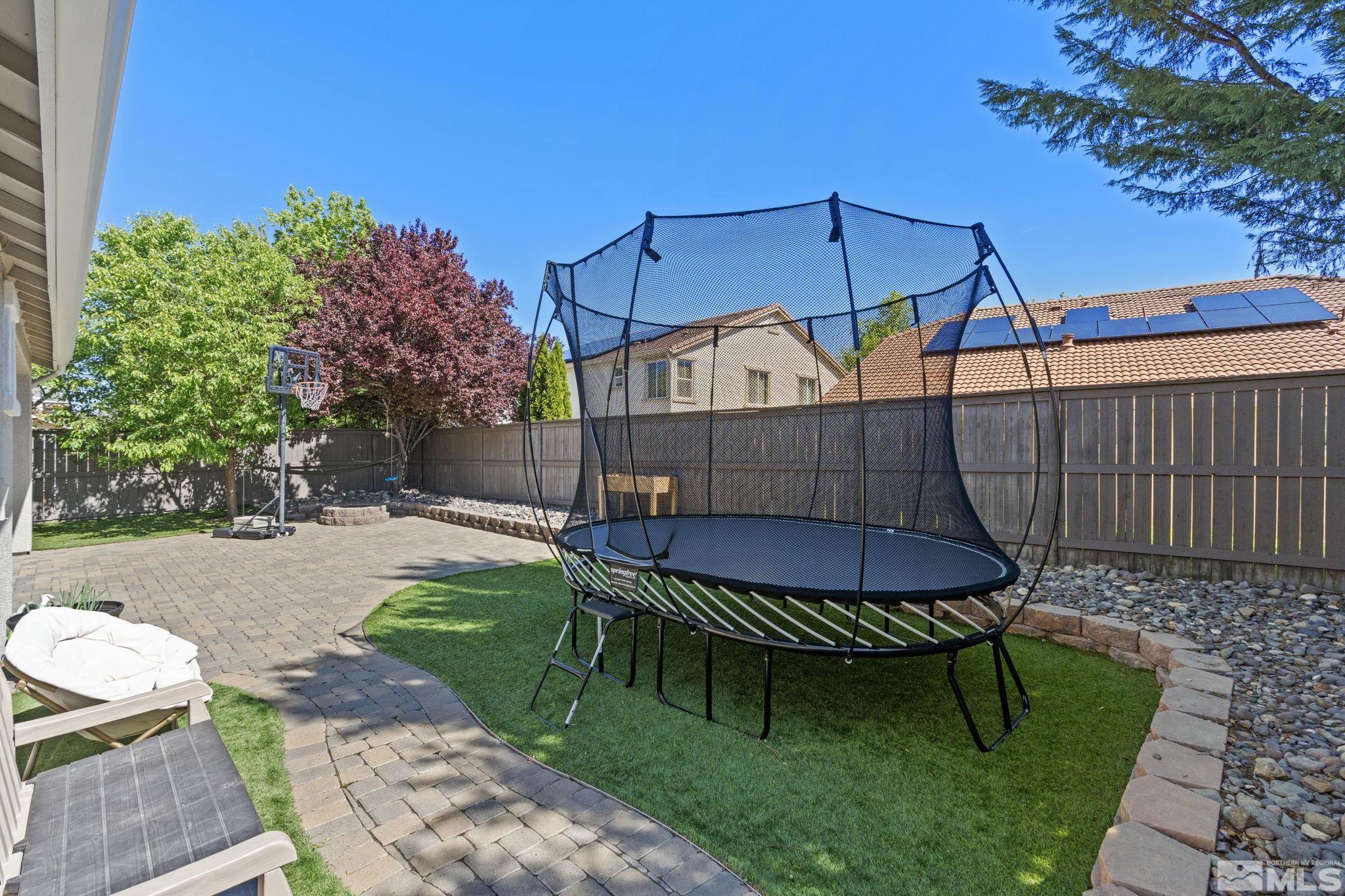541 Needles Court Reno, NV 89521 - Photo 27 of 35 a view of a chair and table in backyard