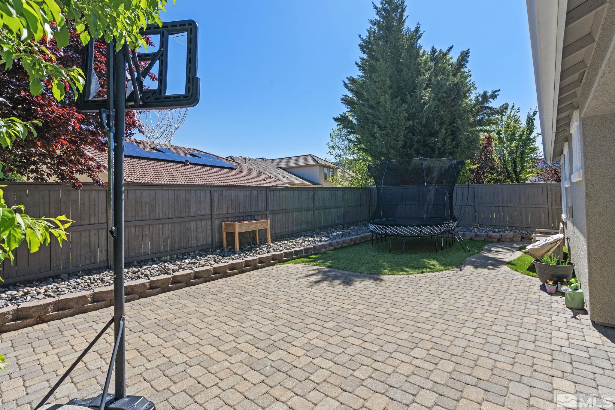 541 Needles Court Reno, NV 89521 - Photo 29 of 35 a street view with wooden fence