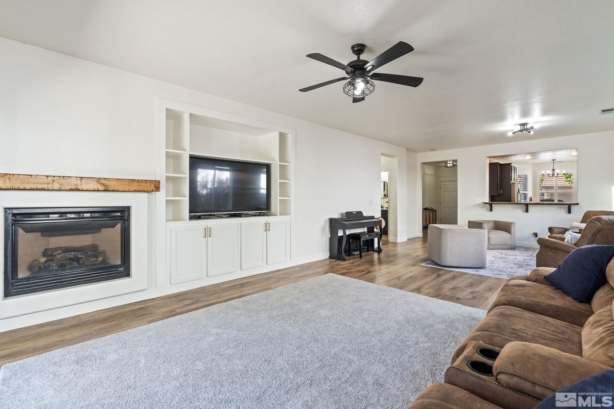 541 Needles Court Reno, NV 89521 - Photo 3 of 35 a living room with furniture and a fireplace