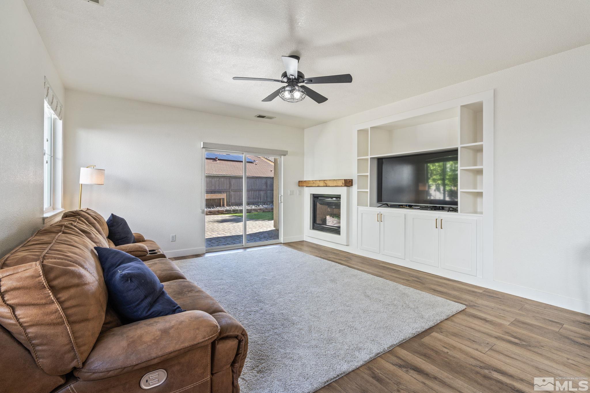 541 Needles Court Reno, NV 89521 - Photo 33 of 35 a living room with furniture and a flat screen tv