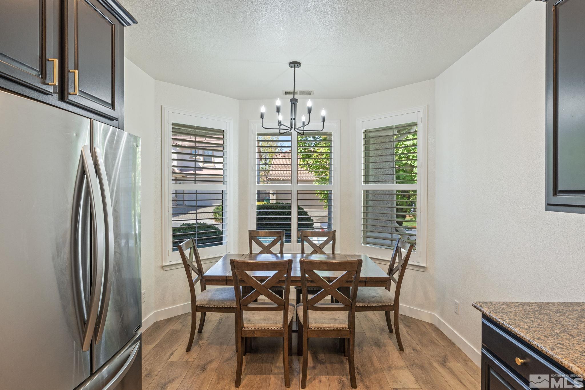 541 Needles Court Reno, NV 89521 - Photo 4 of 35 a view of a dining room with furniture window and outside view