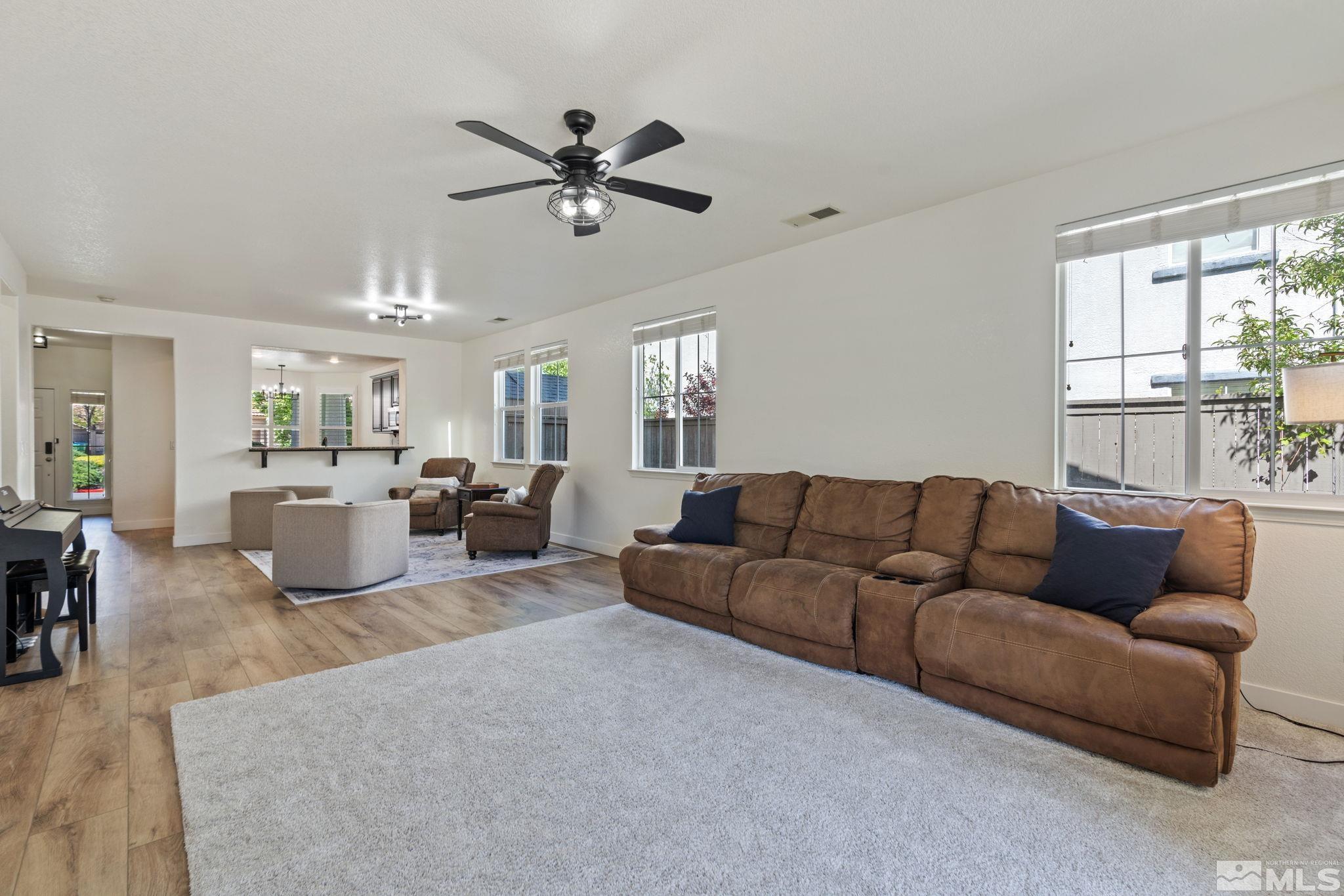 541 Needles Court Reno, NV 89521 - Photo 5 of 35 a living room with furniture kitchen area and a window