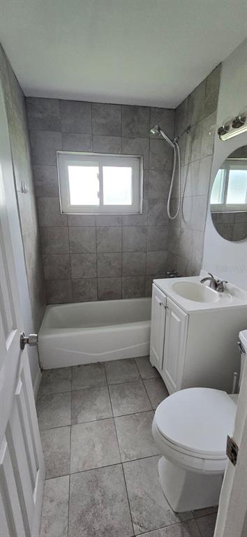 480 Sharon Circle Port Charlotte, FL 33952 - Photo 11 of 16 a bathroom with a toilet a sink and bathtub