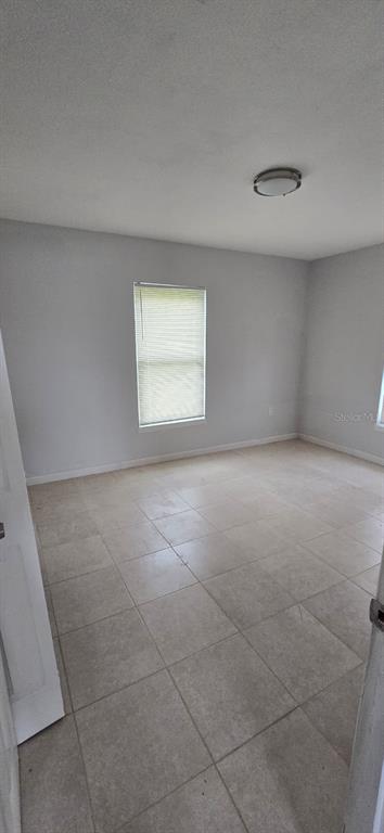480 Sharon Circle Port Charlotte, FL 33952 - Photo 13 of 16 an empty room with a window