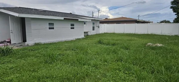 a view of a back yard of the house
