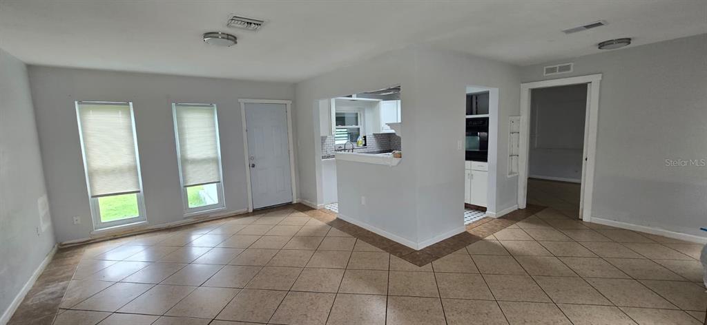 480 Sharon Circle Port Charlotte, FL 33952 - Photo 3 of 16 a view of a hallway with bathroom and a window