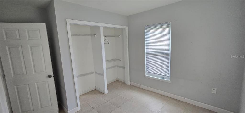 480 Sharon Circle Port Charlotte, FL 33952 - Photo 8 of 16 an empty room with windows