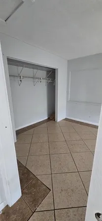 a view of a room with an empty space