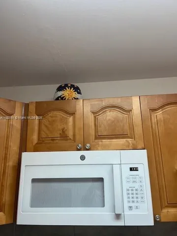 a view of a room with a large window