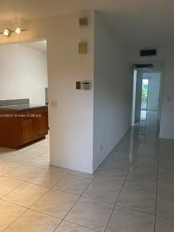 a white toilet sitting next to a shower