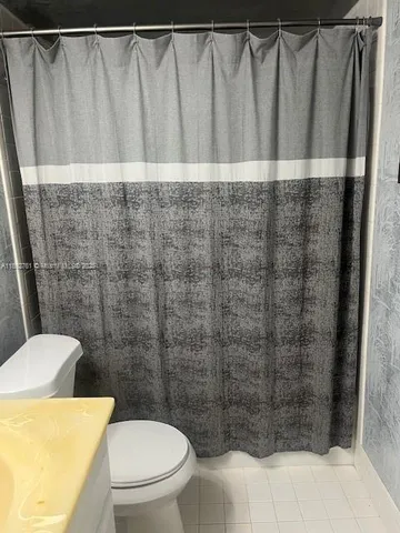 a bathroom with a sink a toilet and a bathtub