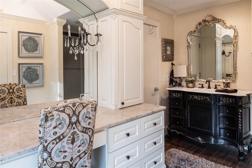 2312 Cactus Rio Lane Weatherford, TX 76087 - Photo 30 of 37 a spacious bathroom with a granite countertop sink a mirror a vanity and a shower