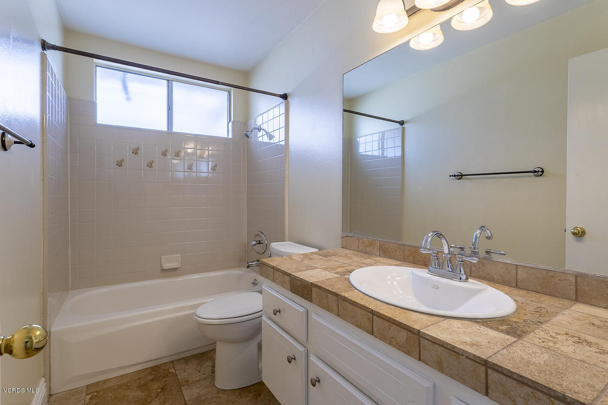 2276 Rohner Court Simi Valley, CA 93063 - Photo 11 of 20 a bathroom with a granite countertop sink toilet and shower