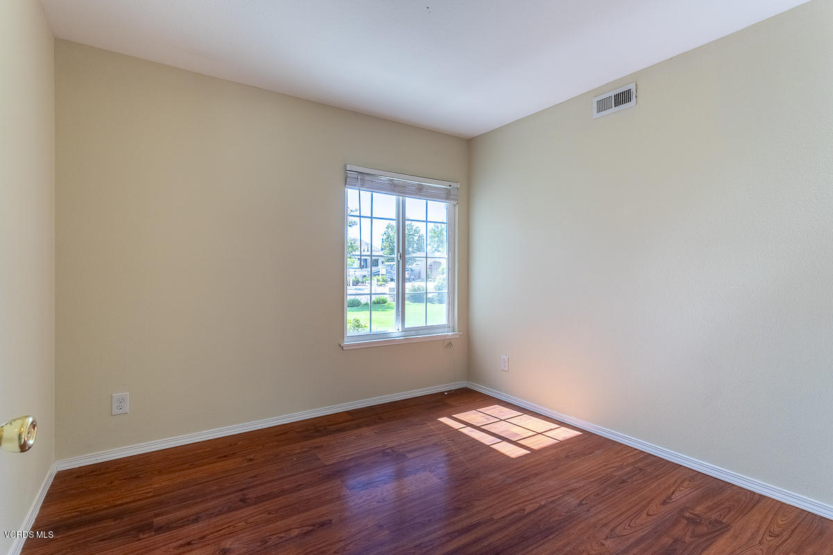 2276 Rohner Court Simi Valley, CA 93063 - Photo 12 of 20 a view of empty room with wooden floor and fan