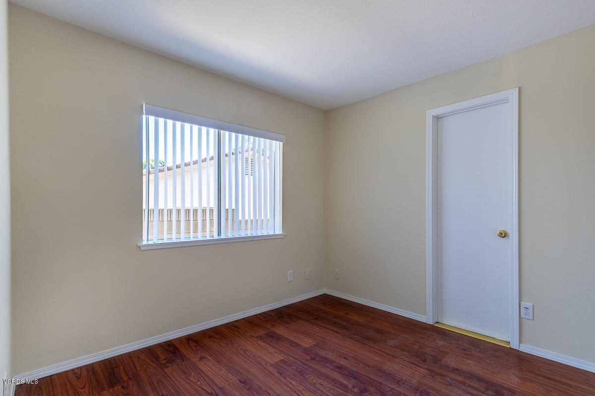 2276 Rohner Court Simi Valley, CA 93063 - Photo 13 of 20 an empty room with wooden floor and windows