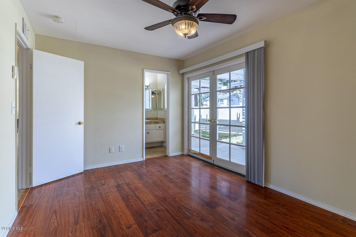 2276 Rohner Court Simi Valley, CA 93063 - Photo 15 of 20 an empty room with wooden floor fan and windows