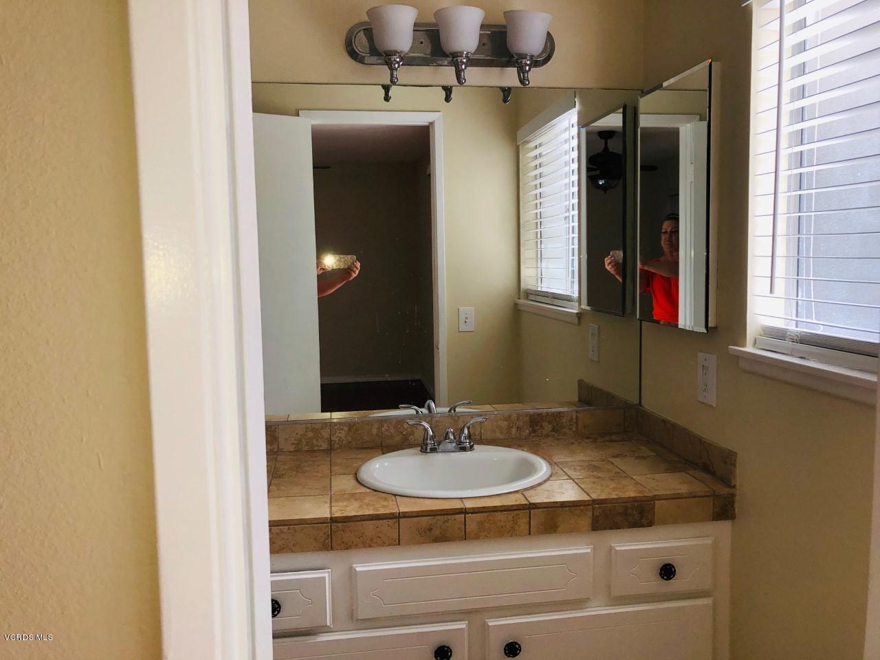 2276 Rohner Court Simi Valley, CA 93063 - Photo 17 of 20 a bathroom with a sink and a mirror