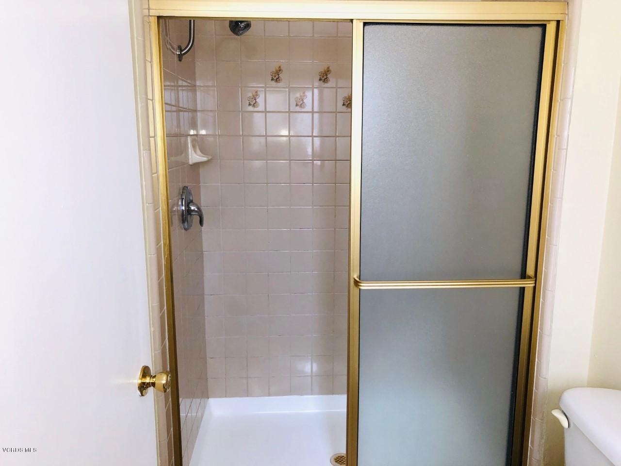 2276 Rohner Court Simi Valley, CA 93063 - Photo 18 of 20 a bathroom with a glass shower door