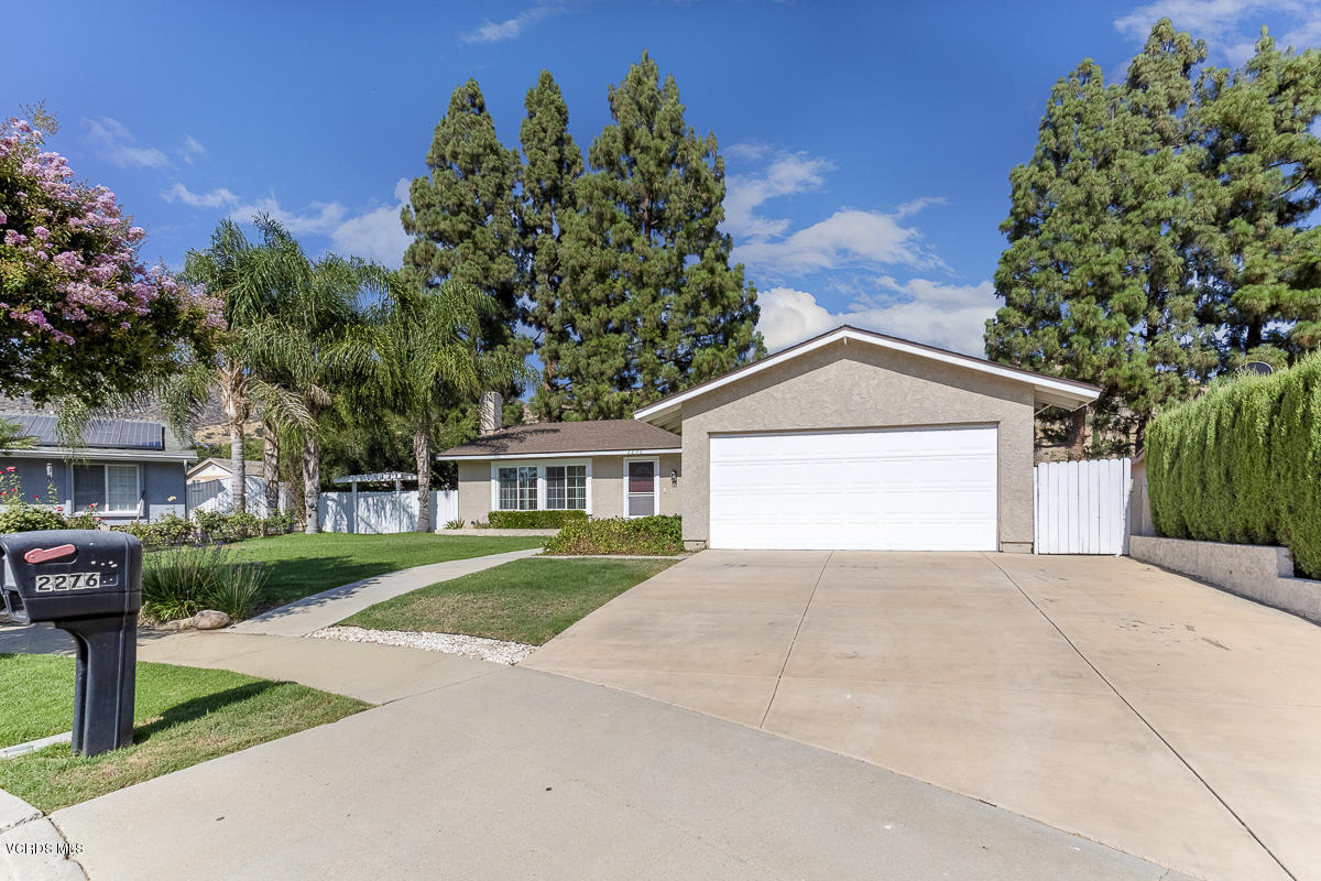 2276 Rohner Court Simi Valley, CA 93063 - Photo 3 of 20 a front view of a house with a yard and garage