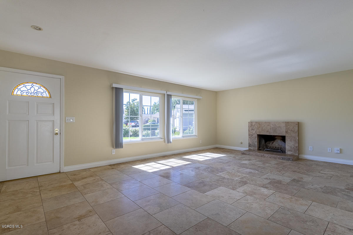 2276 Rohner Court Simi Valley, CA 93063 - Photo 5 of 20 a view of an empty room with a fireplace and a window