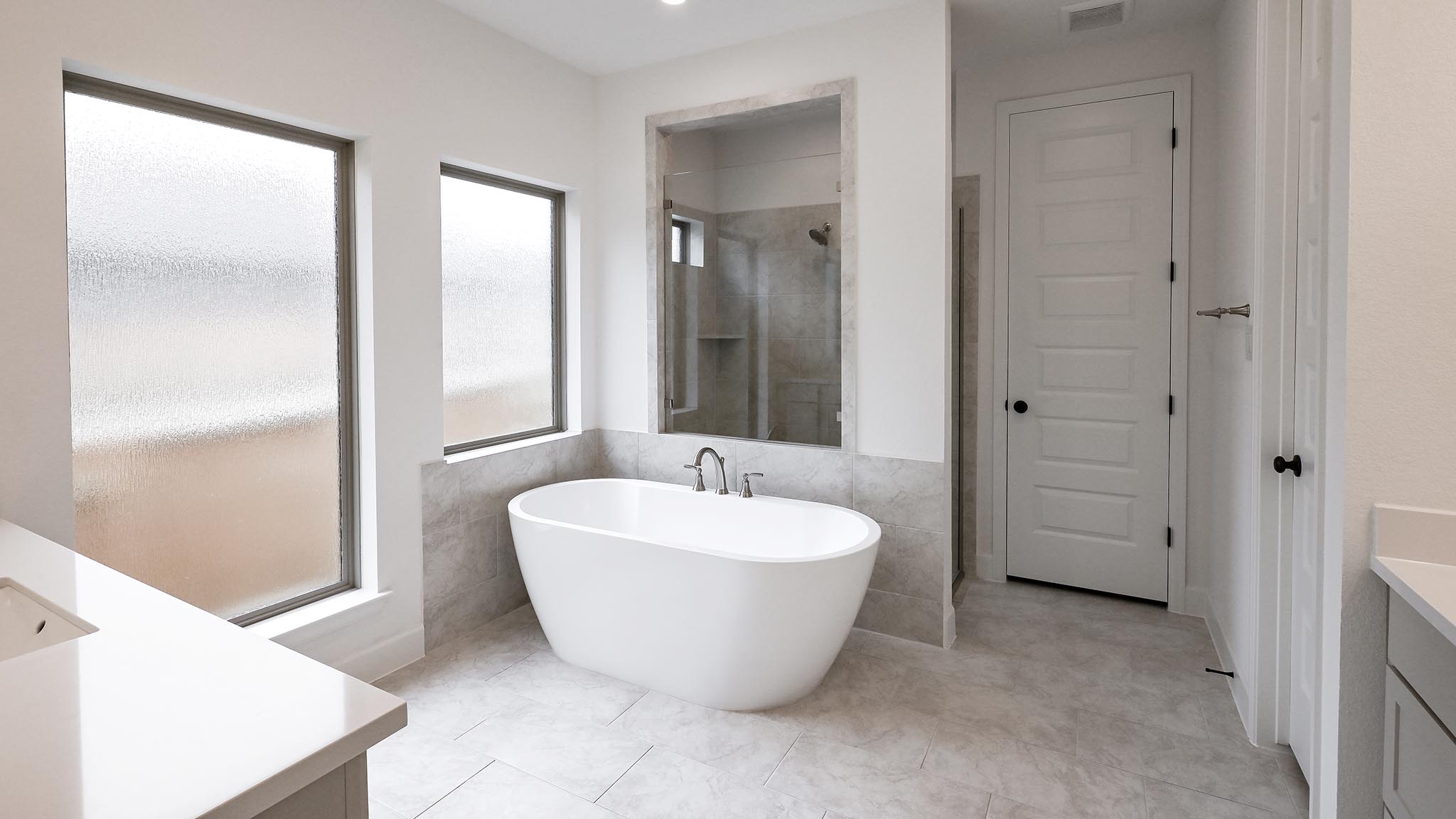 268 Basket Flower Loop Kyle, TX 78640 - Photo 9 of 27 a spacious bathroom with a bathtub and shower