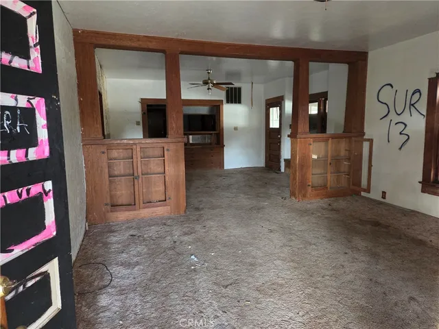 a view of empty room with floor to ceiling window