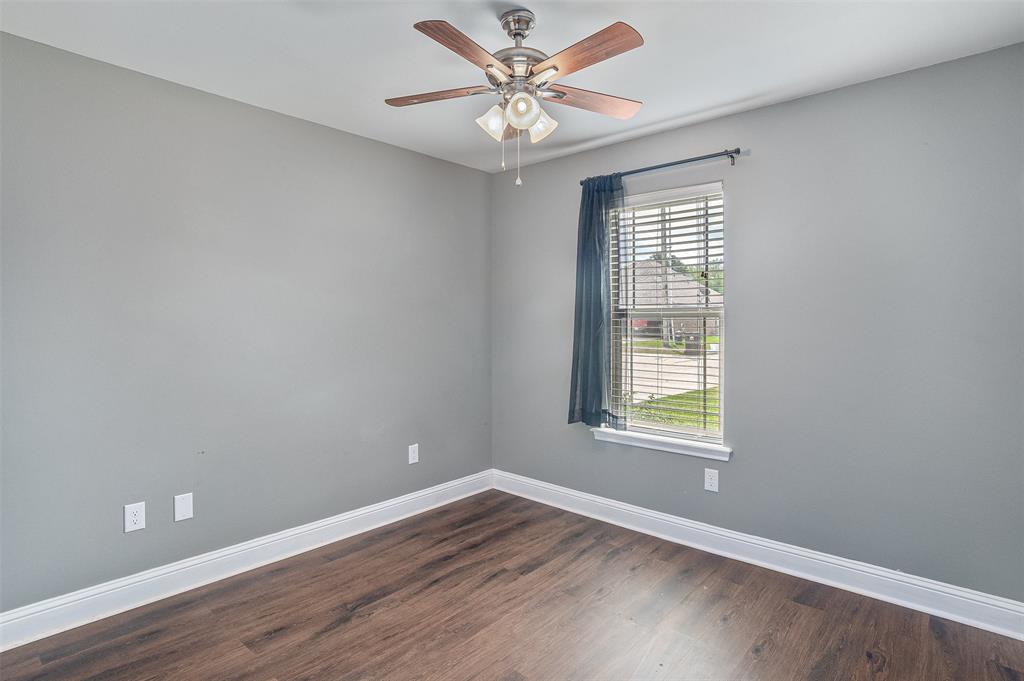 521 Big Red Circle Haughton, LA 71037 - Photo 16 of 19 an empty room with wooden floor and windows