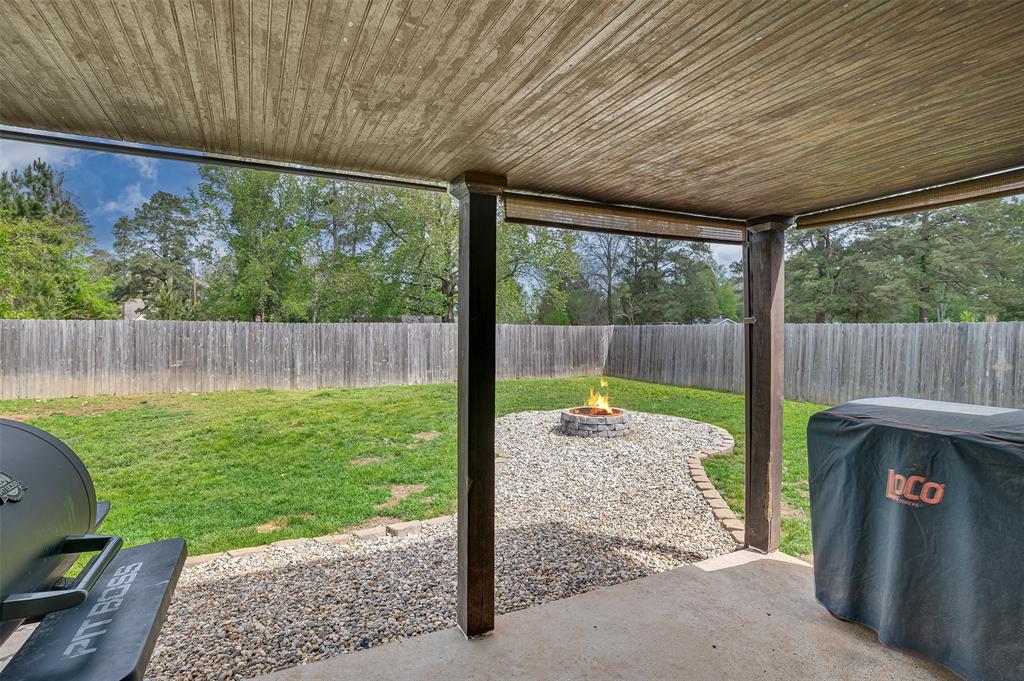 521 Big Red Circle Haughton, LA 71037 - Photo 18 of 19 a backyard of a house with table and chairs