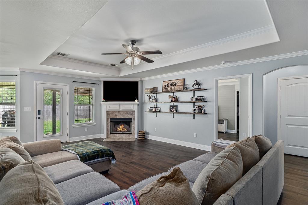 521 Big Red Circle Haughton, LA 71037 - Photo 4 of 19 a living room with furniture a fireplace and a flat screen tv