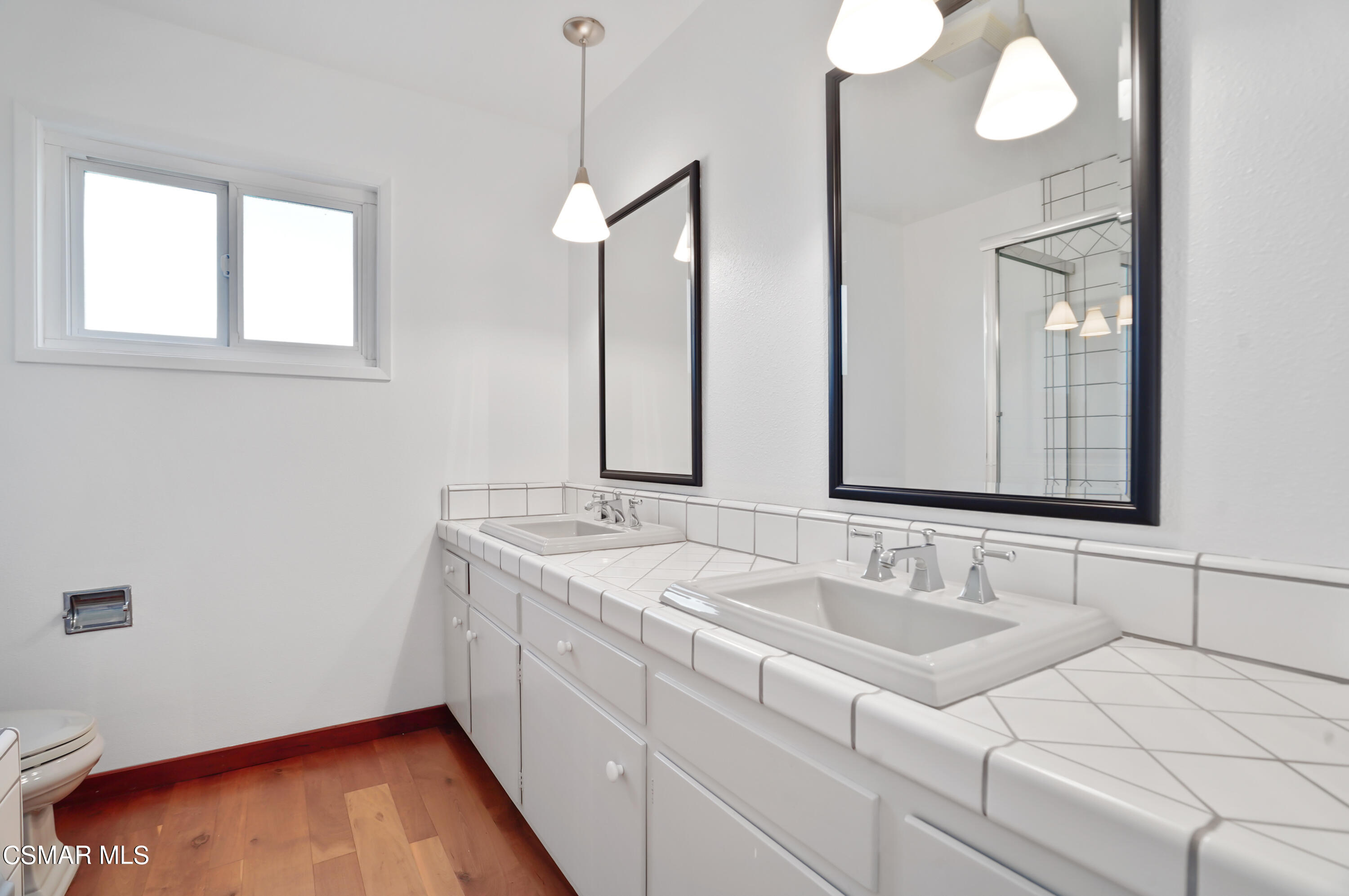 16 Mansfield Lane Camarillo, CA 93010 - Photo 14 of 22 a bathroom with a sink and a mirror