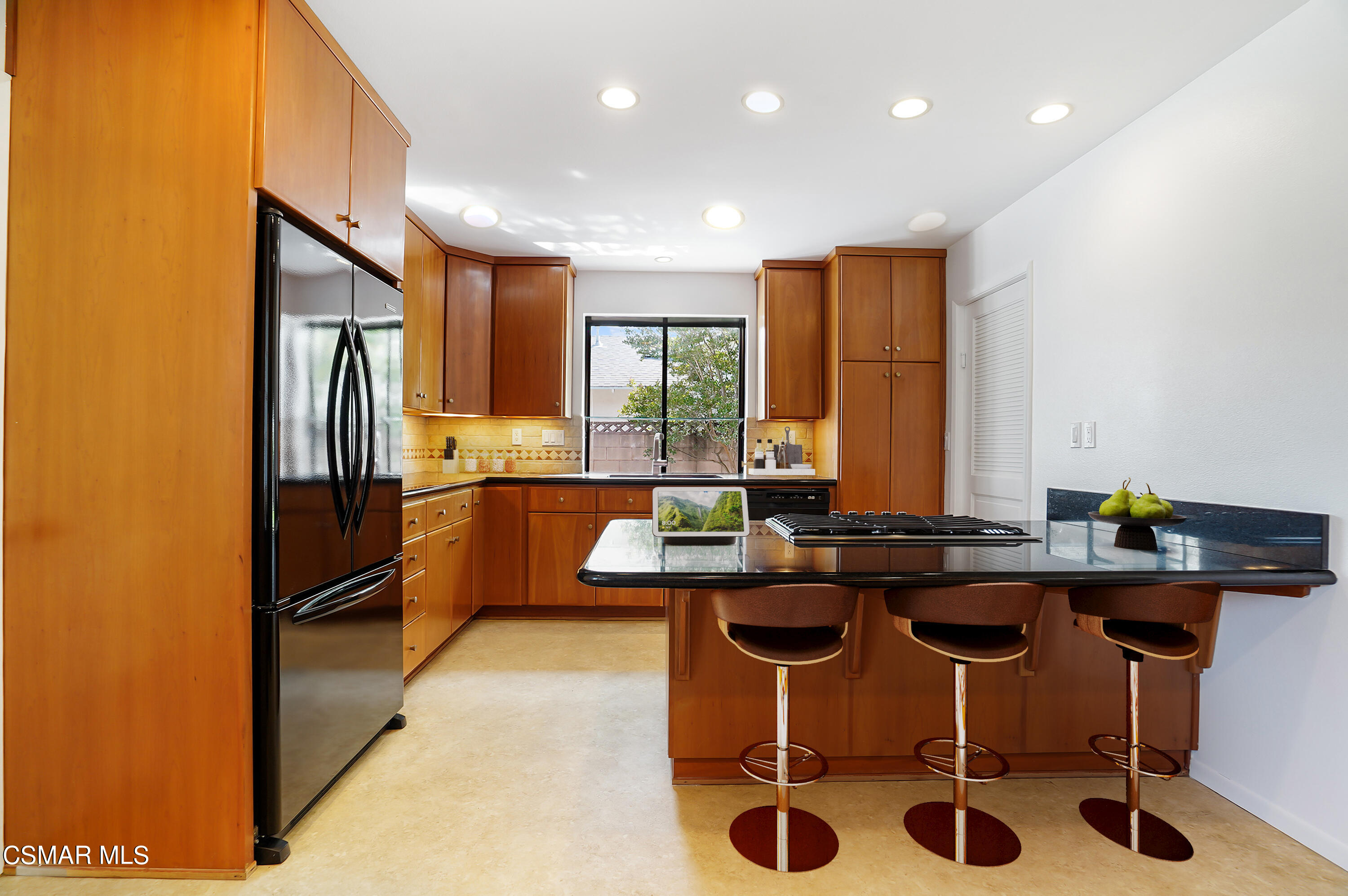 16 Mansfield Lane Camarillo, CA 93010 - Photo 3 of 22 a kitchen with a sink a counter top stainless steel appliances and cabinets
