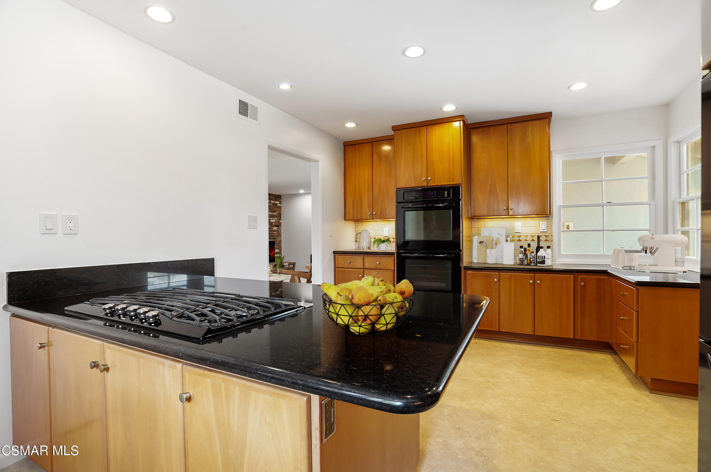 16 Mansfield Lane Camarillo, CA 93010 - Photo 4 of 22 a kitchen with stainless steel appliances granite countertop a stove a sink and a refrigerator