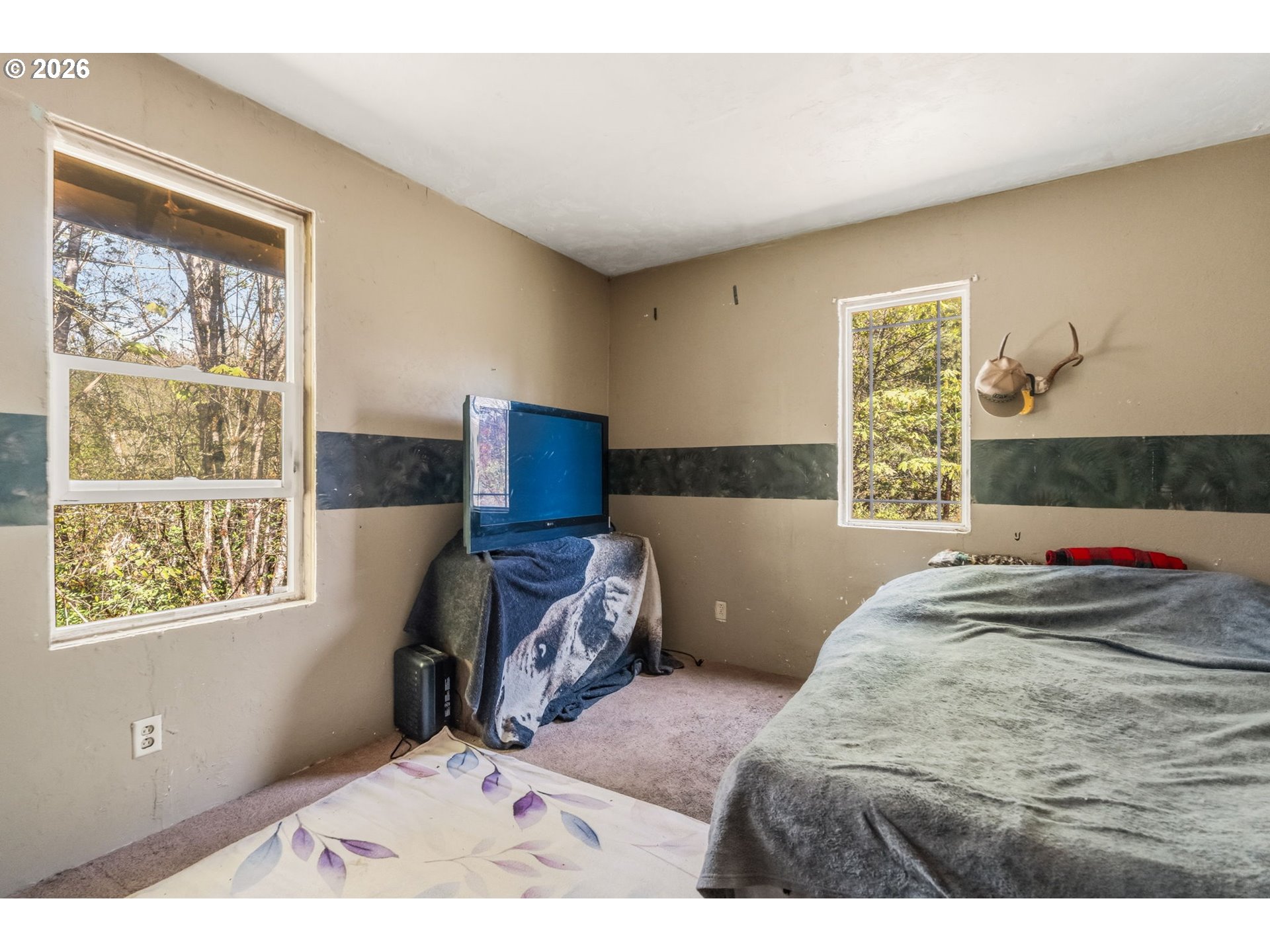 21542 Highway 126 Noti, OR 97461 - Photo 17 of 22 a bedroom with a bed and wooden floor