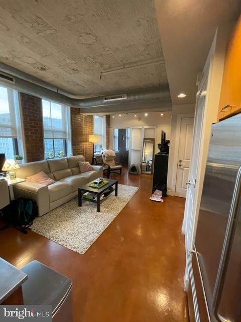 916 G St. Northwest, Unit 805 Washington, DC 20001 - Photo 11 of 19 a living room with furniture and a table