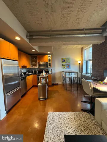 a living room with lots of furniture and a flat screen tv