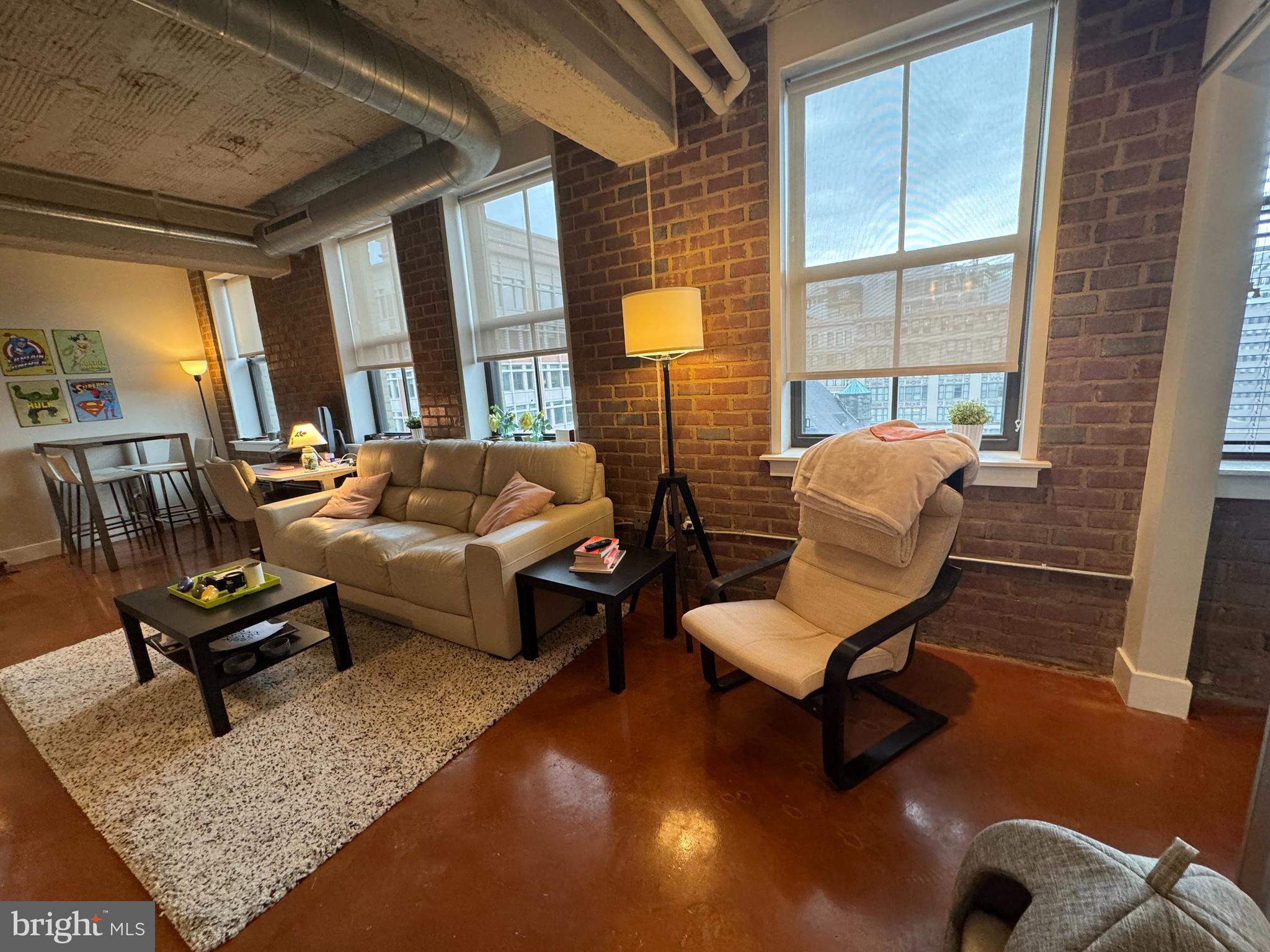 916 G St. Northwest, Unit 805 Washington, DC 20001 - Photo 16 of 19 a living room with furniture and a floor to ceiling window