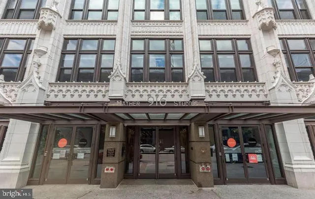 a front view of a building with glass windows