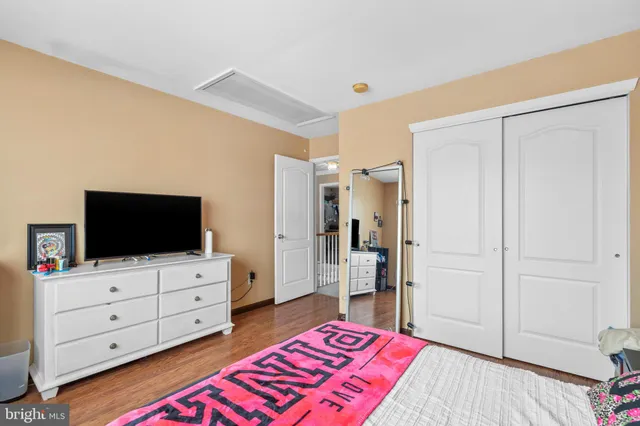 a living room with furniture and flat screen tv