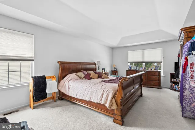 a bed room with a bed and a window