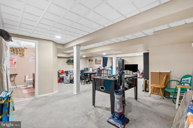 a view of a livingroom with dining room and workspace