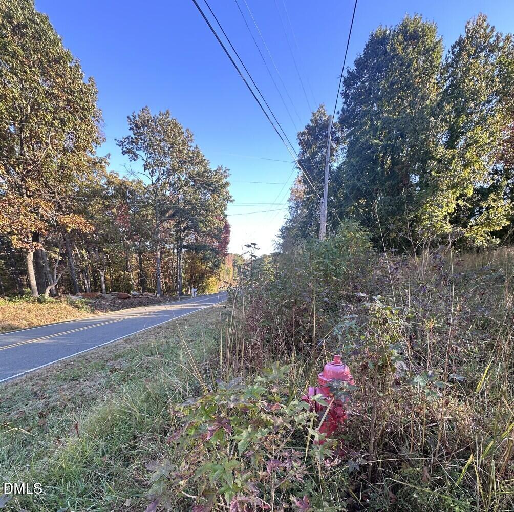 6900-6918 Russell Road Durham, NC 27712 - Photo 17 of 22 a view of yard with tree in the background