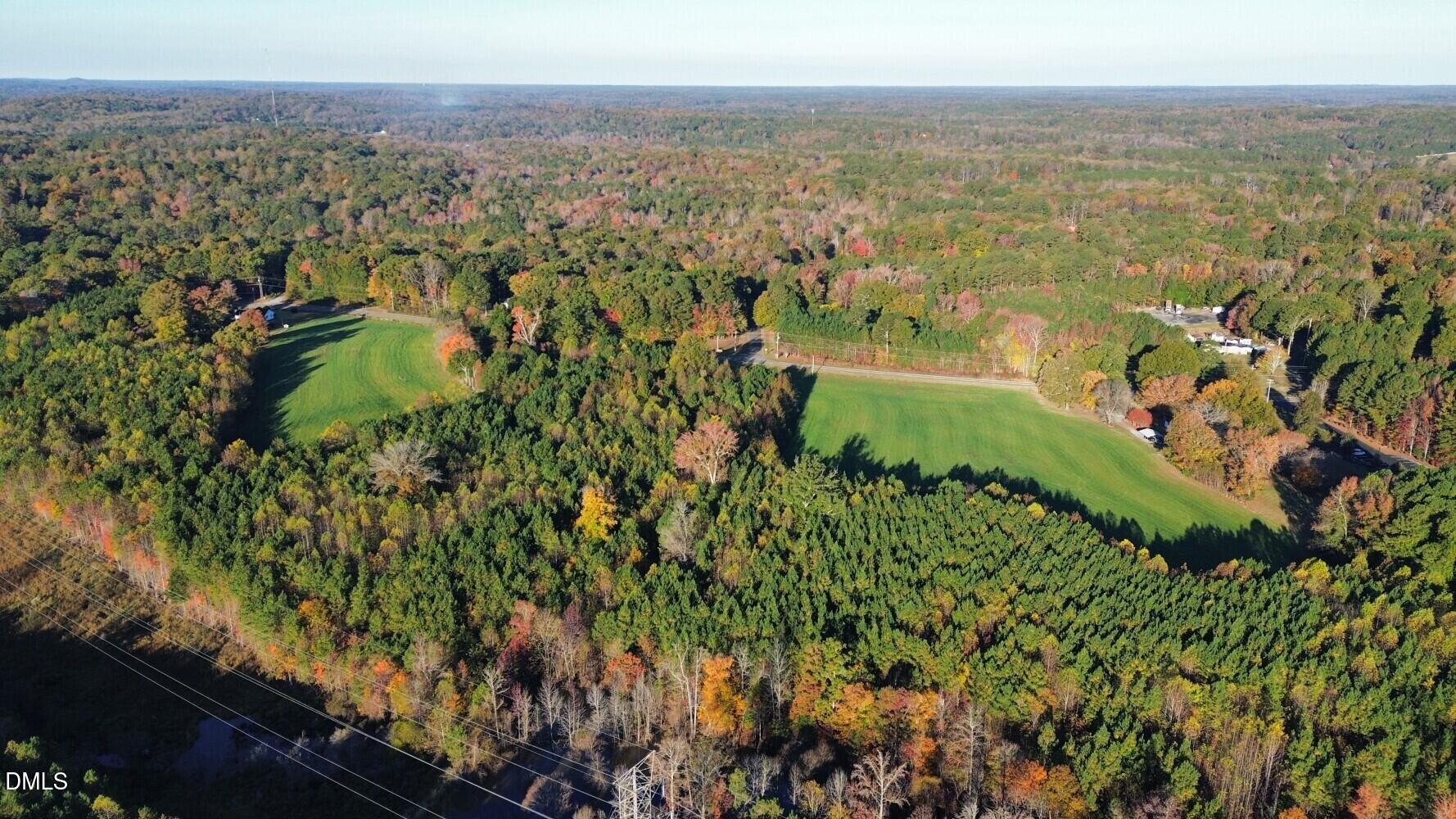 6900-6918 Russell Road Durham, NC 27712 - Photo 4 of 22 an aerial view of residential building and green space