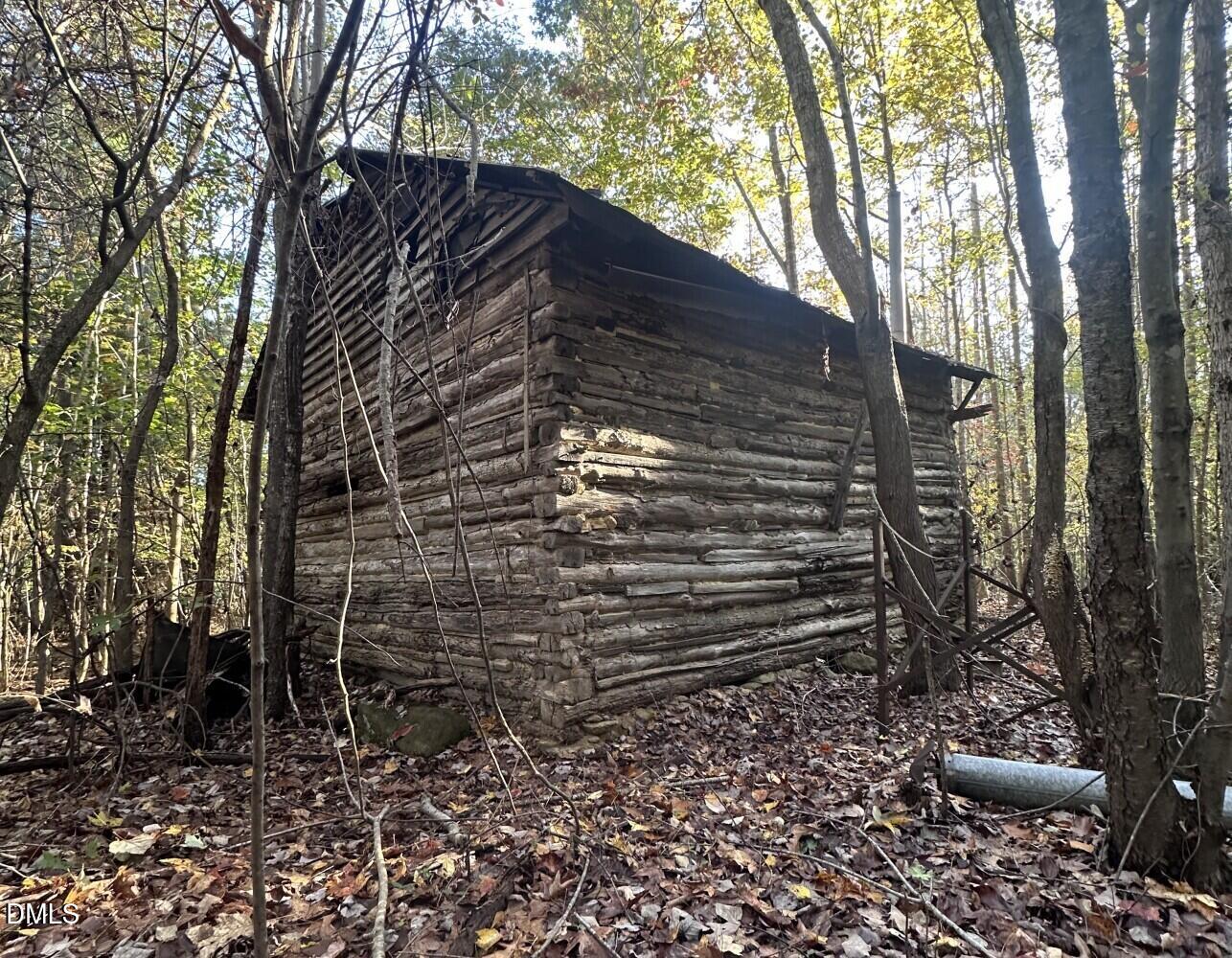 6900-6918 Russell Road Durham, NC 27712 - Photo 9 of 22 a view of house with backyard