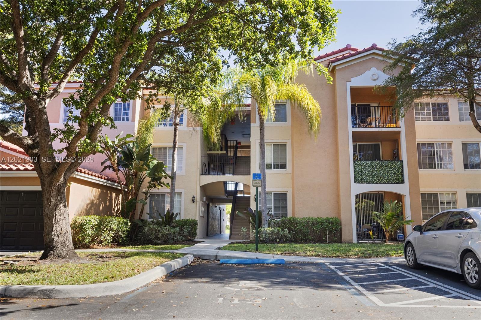2123 Renaissance Boulevard, Unit 201 Miramar, FL 33025 - Photo 21 of 22 a front view of a building with street view