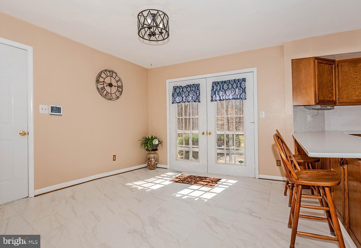 213 King James Road Upper Marlboro, MD 20774 - Photo 11 of 41 The kitchen table space with doors to the outside