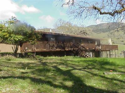 321 Sanel Drive Ukiah, CA 95482 - Photo 11 of 12 a backyard of a house with lots of green space