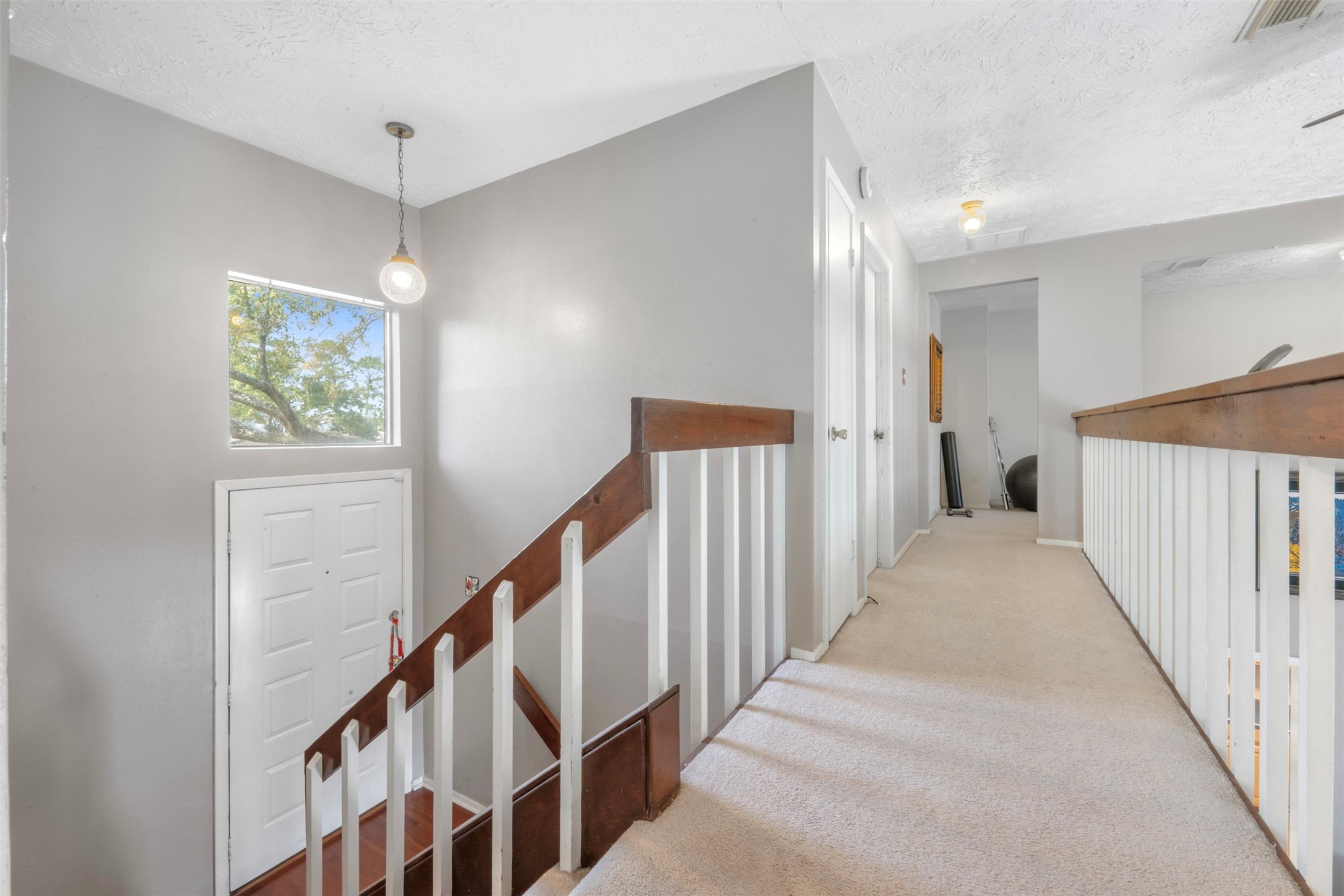 17314 Edenbridge Court Spring, TX 77379 - Photo 20 of 33 a view of a hallway with stairs