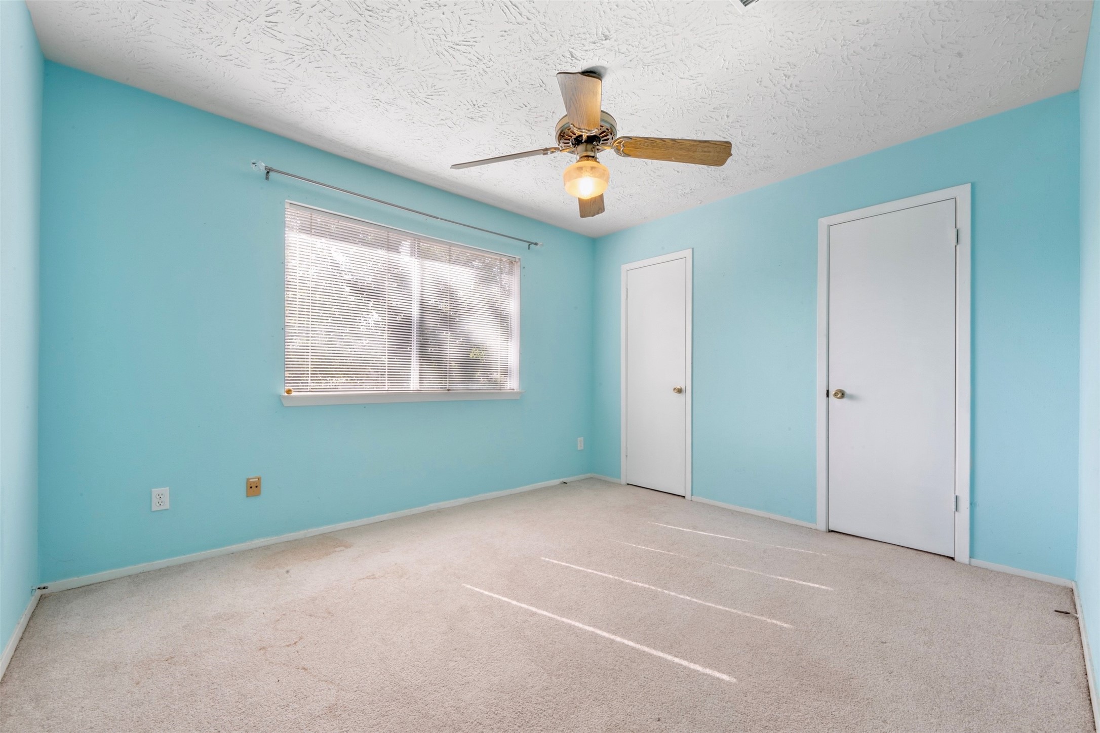 17314 Edenbridge Court Spring, TX 77379 - Photo 23 of 33 an empty room with windows and fan
